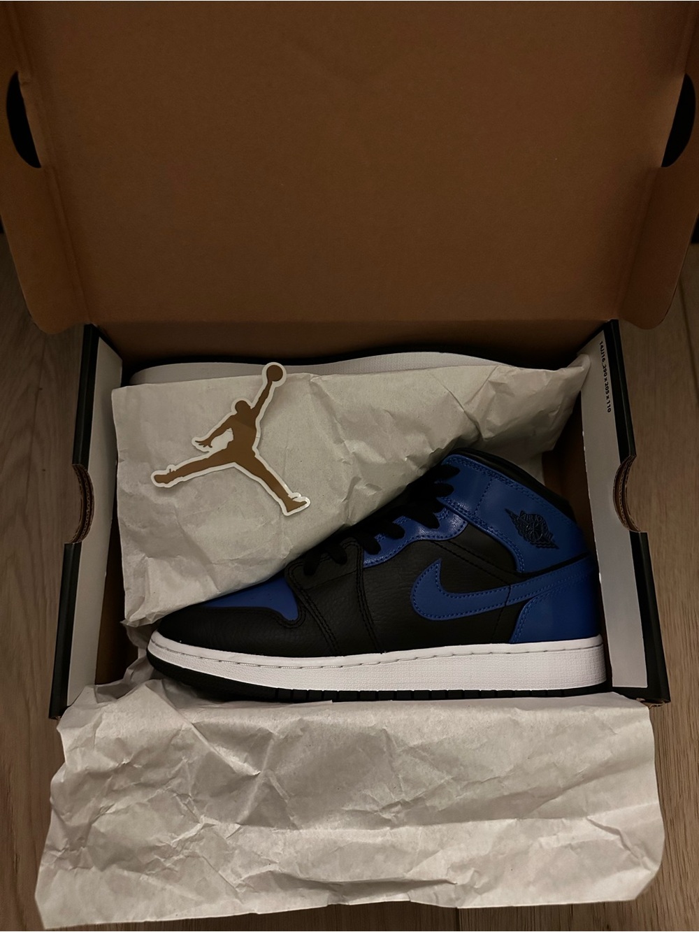 Jordan Men's High-Top Sneaker in Black and Blue